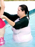 big babe with huge boobs playing in pool