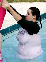 big babe with huge boobs playing in pool